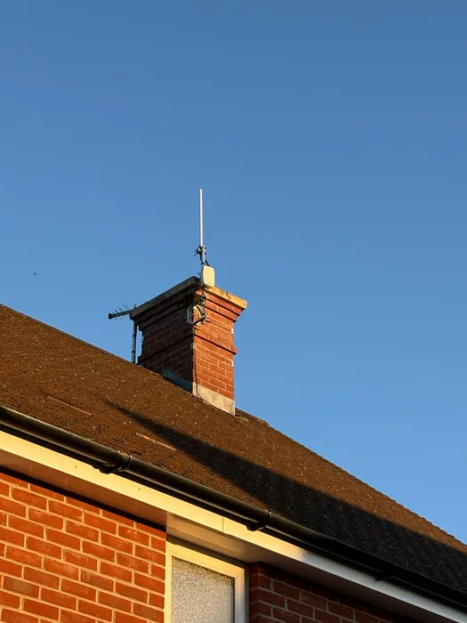 LoRaWAN gateway and aerial fitted to a brick chimney stack