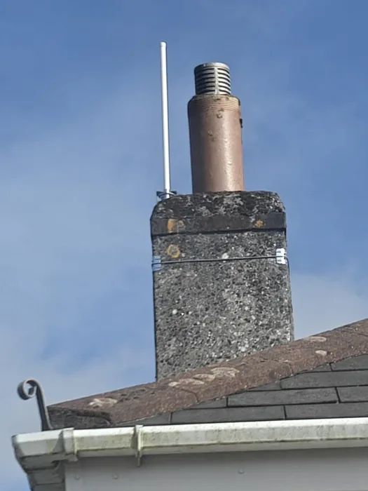 White aerial mounted on a stone chimney stack