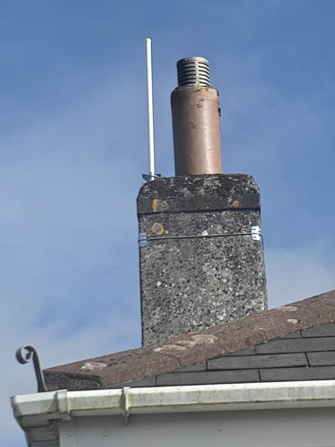 Installed smart water meter aerial, mounted to a chimney